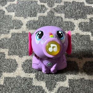 Purple and Pink Learning Toy with Interactive Features